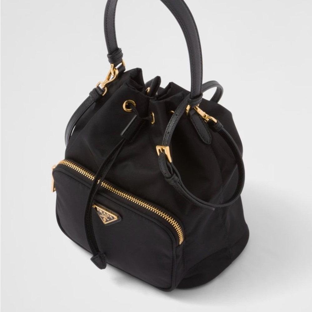 In prestine excellent condition 9/10 condition Prada duet re-nylon bucket bag